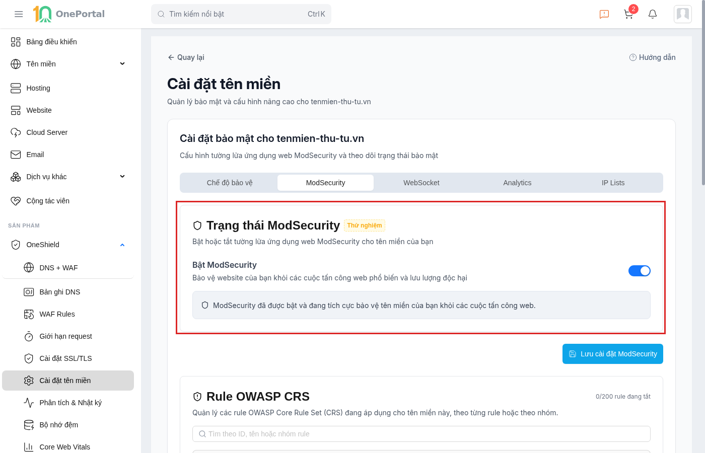 Thẻ ModSecurity trên OneShield, khoanh đỏ khối Trạng thái ModSecurity gồm công tắc Bật ModSecurity đang bật và dòng xác nhận ModSecurity đang tích cực bảo vệ tên miền